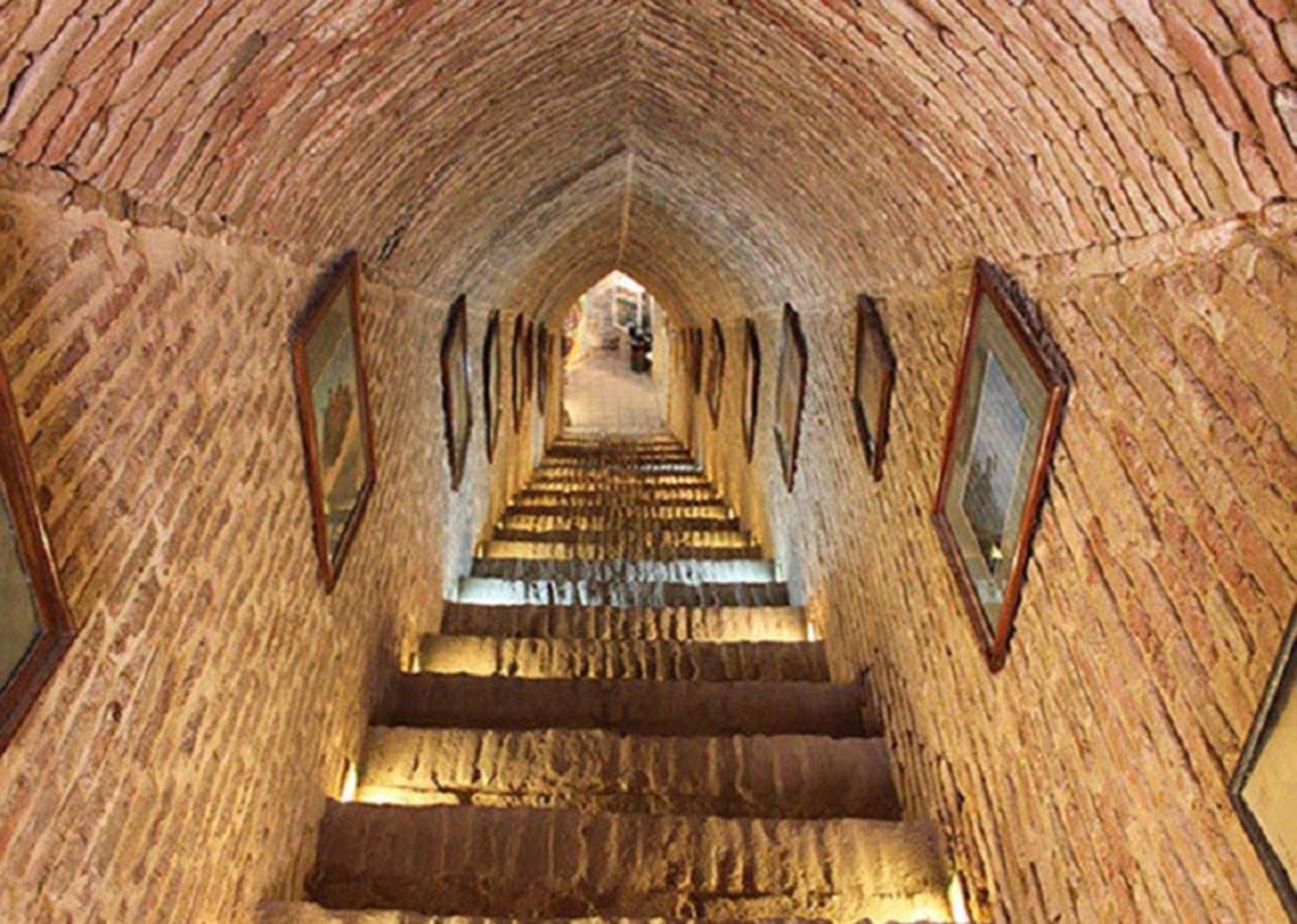 The long brick-vaulted stairway descending into the Shariat ab anbar