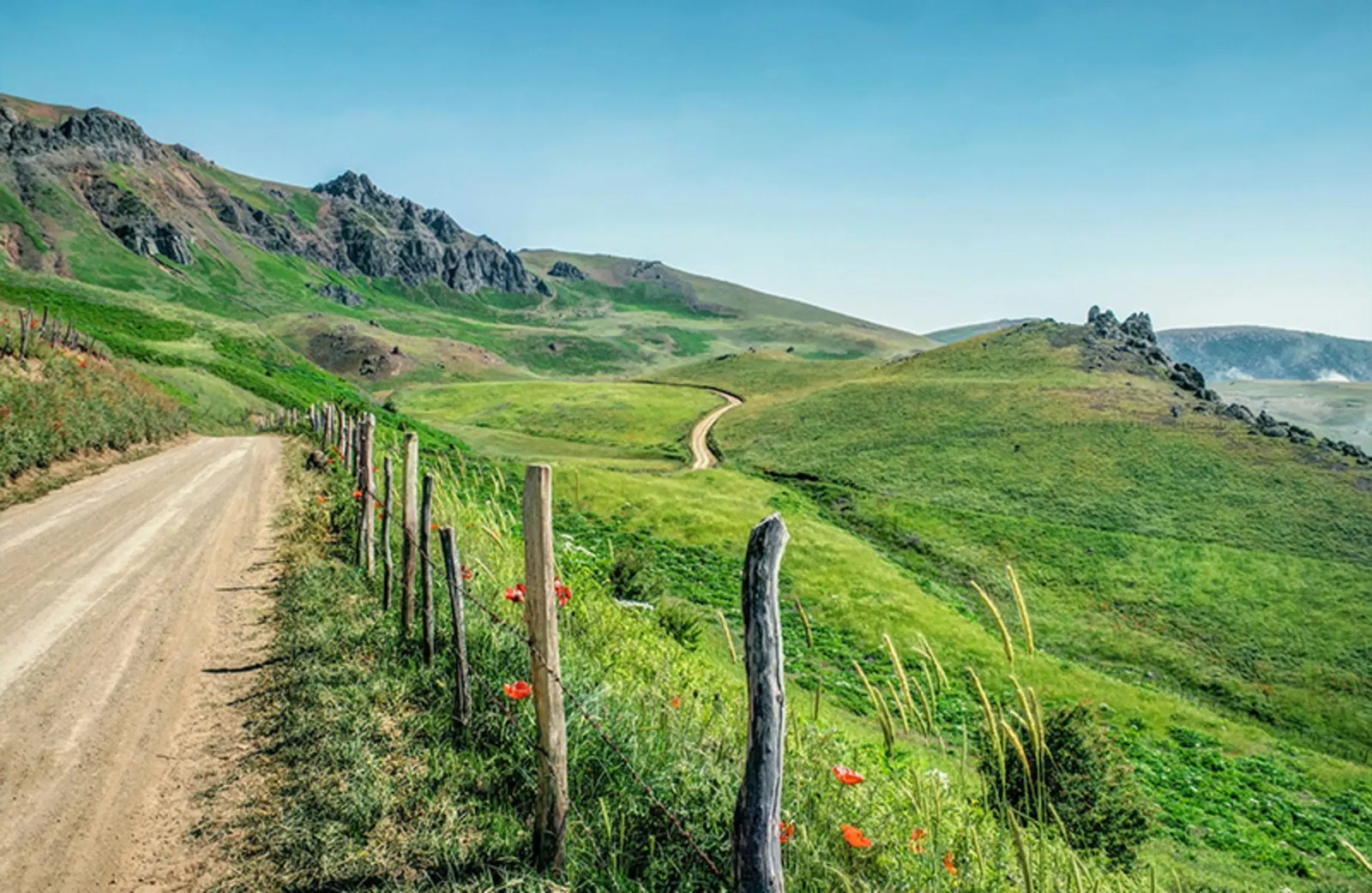 The dirt track climbing toward the Suvtan summer pasture