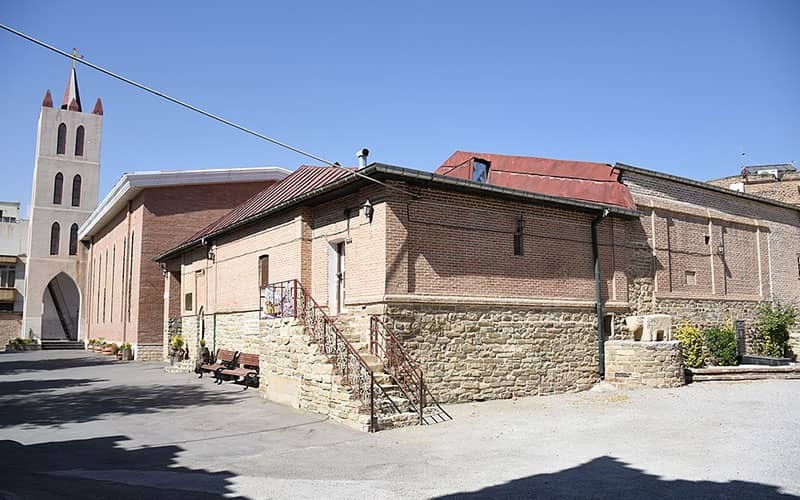 Stone and brick façade of a Qajar-era civic mansion in central Urmia