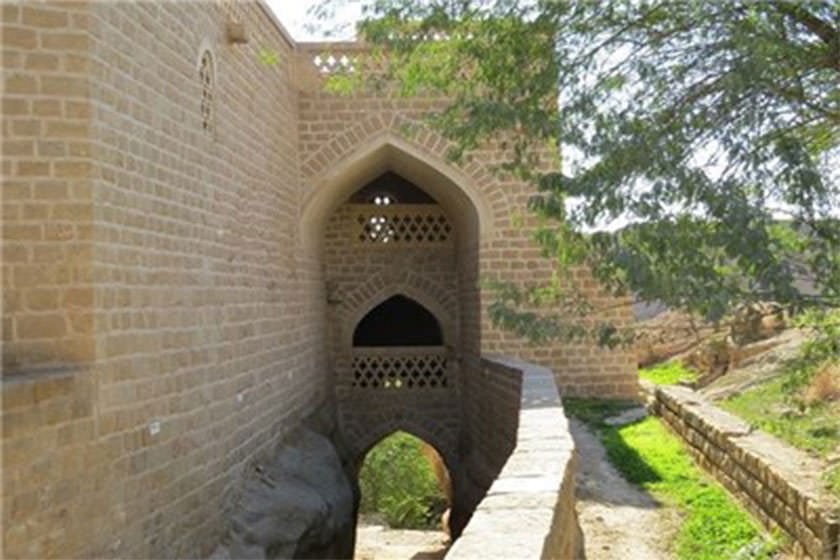 Flower beds and shaded walkways inside Bagh-e Khan