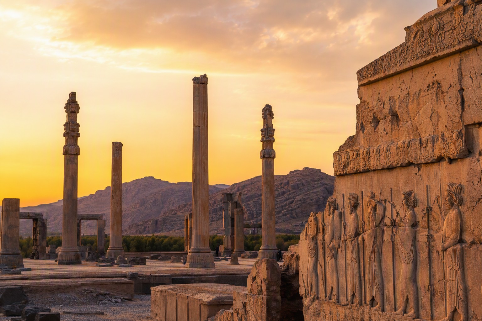 Photographer at Persepolis ruins at golden hour