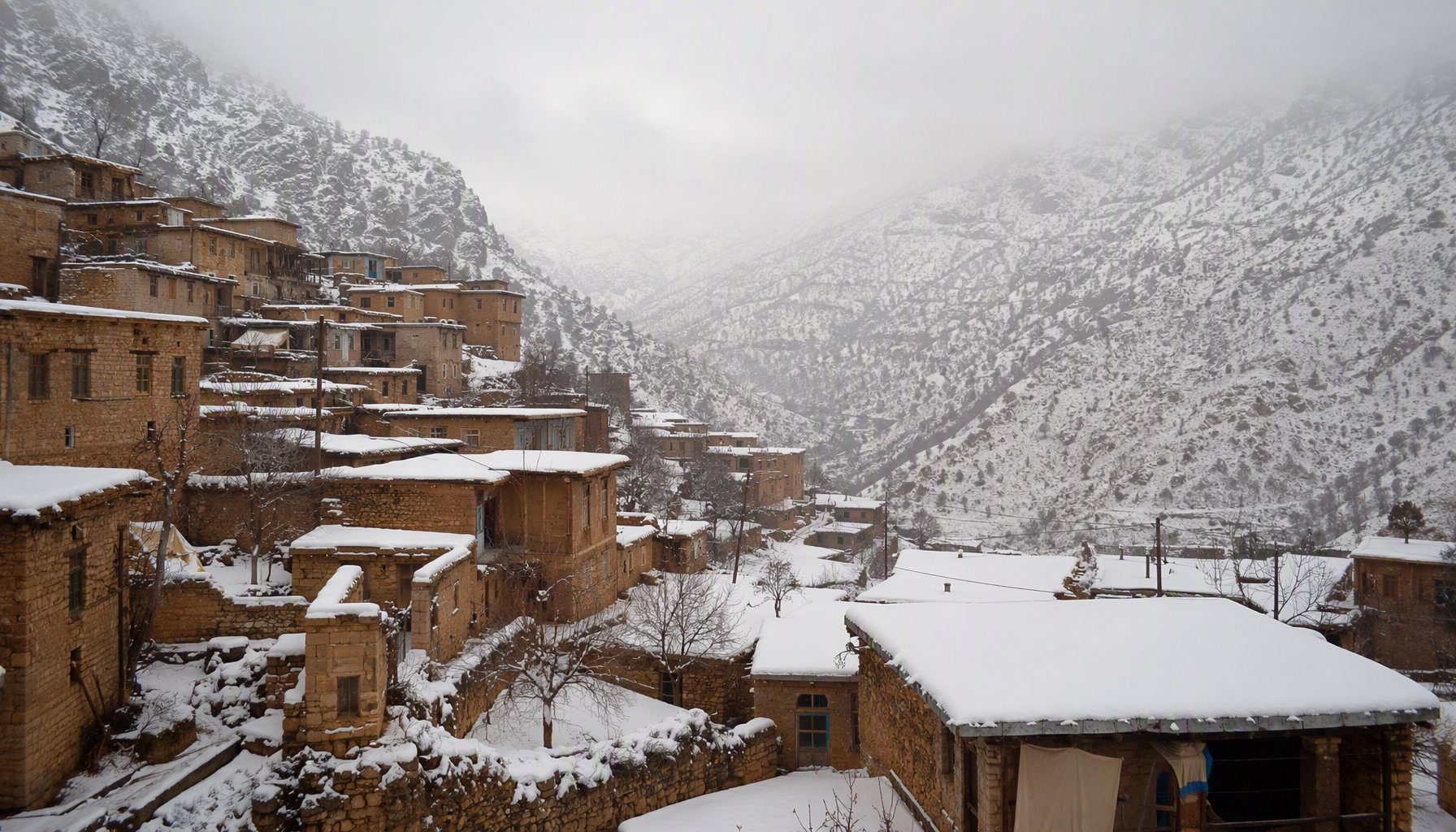 Winter snow covering the villages and mountains of Kurdistan province