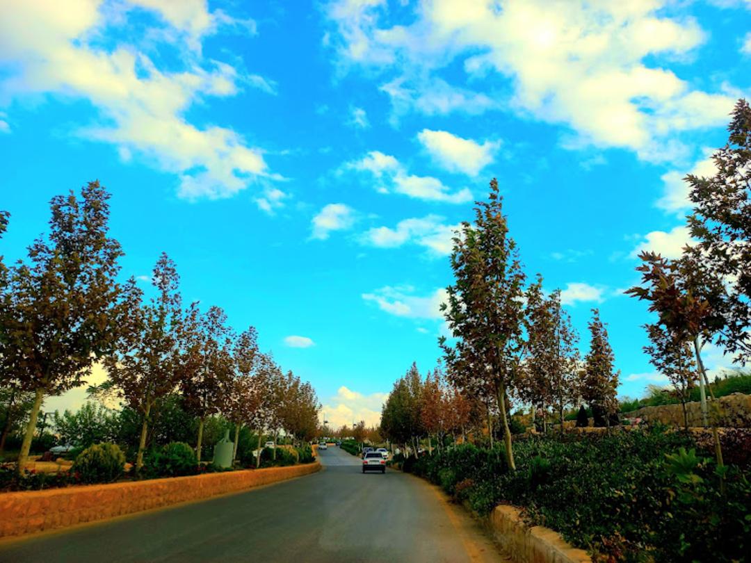 Historic garden wall with fruit trees in Qasr Dasht