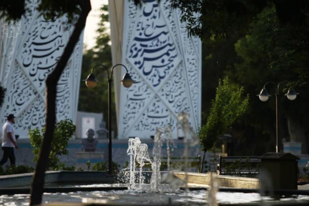 Reflecting pools surrounded by tall trees in Golestan Garden