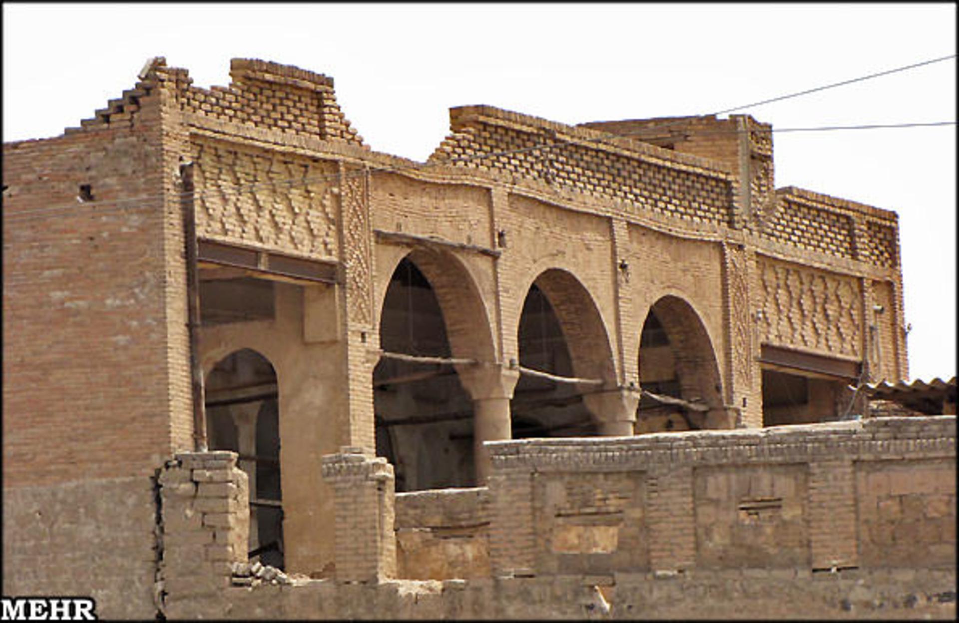 The brick arcades and pointed arches of the Dadras House inside the bazaar