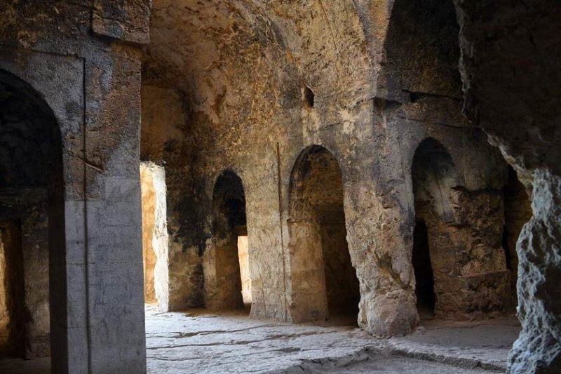 Interior space of the Azarakhsh Fire Temple with natural light entering from above