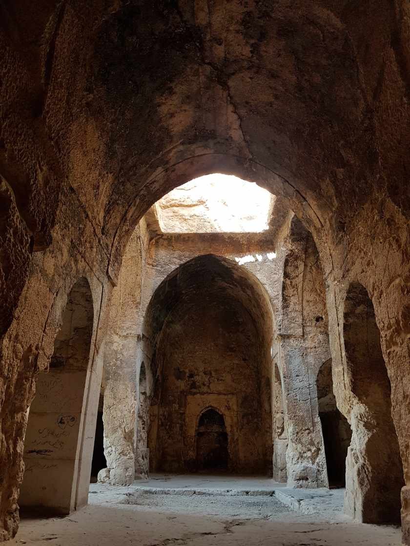 Apse-style architecture of the Azarakhsh Fire Temple showing the rock-carved chambers