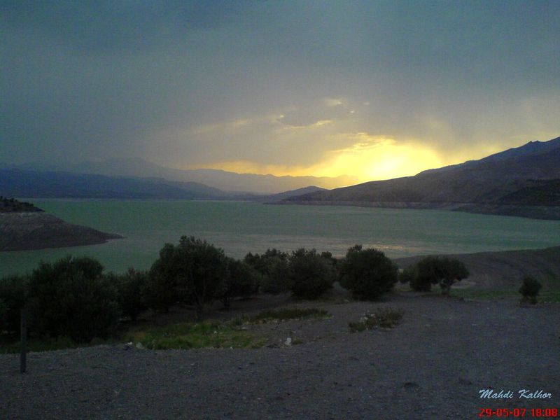 Taleghan valley panorama showing mountains, villages, and the reservoir lake