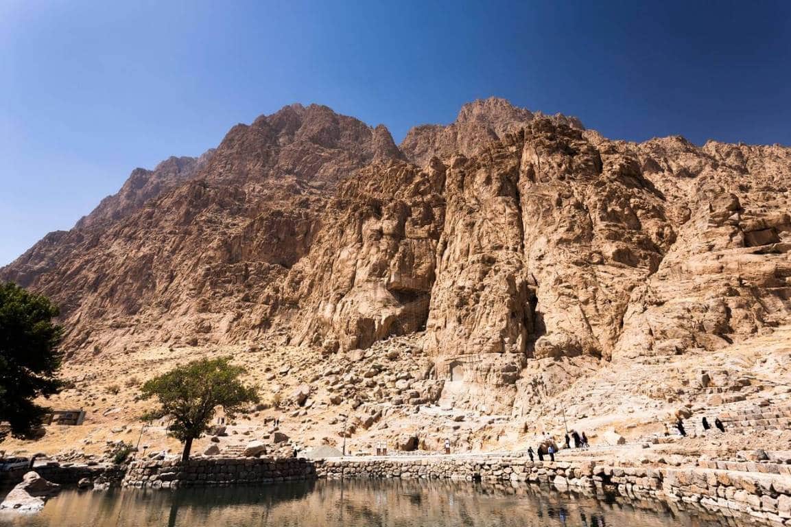 Bisotun archaeological complex and mountain scenery