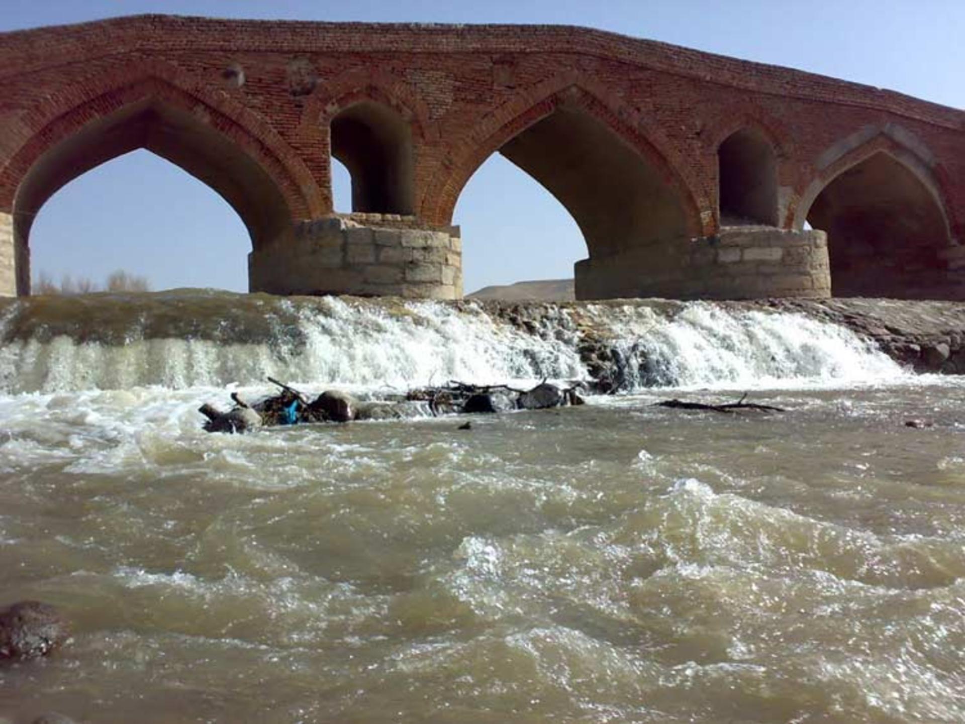 Stone arch bridge over the river