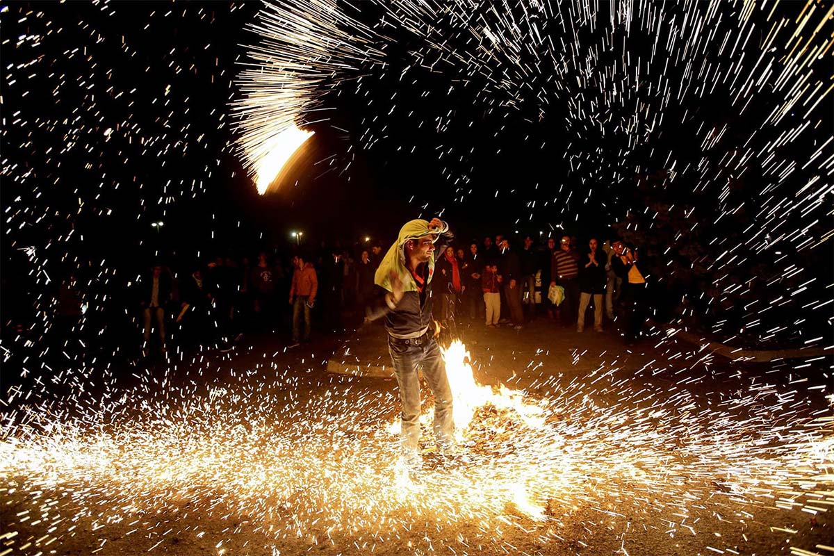 People celebrating Chaharshanbe Suri on the streets