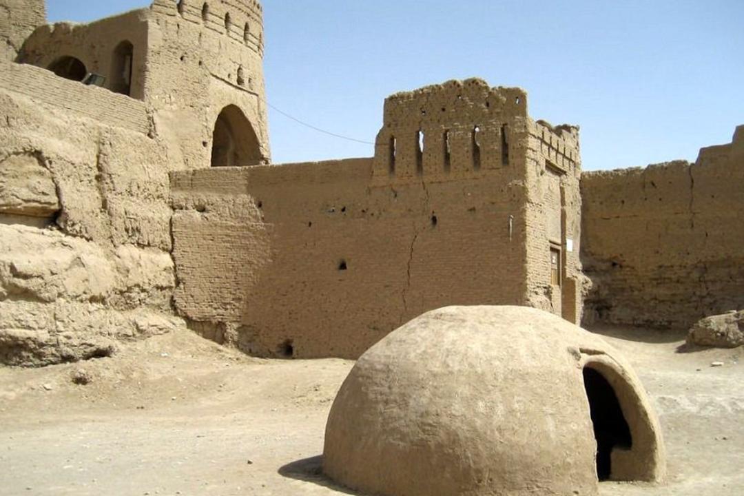 Traditional mud-brick alleyway in the historic district of Meybod